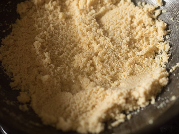 roasting rava in the kadai for rava kesari recipe.