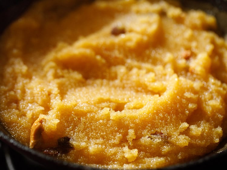 cooking kesari recipe in the pan.