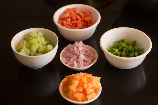 chopped vegetables kept in bowls for making mix veg raita. 
