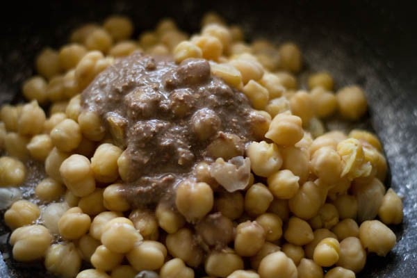 soaked chickpeas and pomegranate seeds paste added to pan