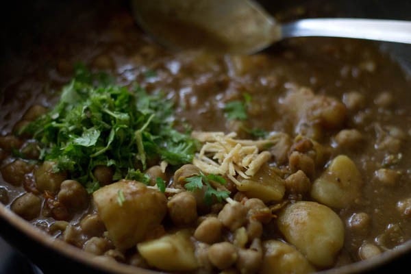 aloo chole sabzi garnished with coriander leaves and ginger juliennes