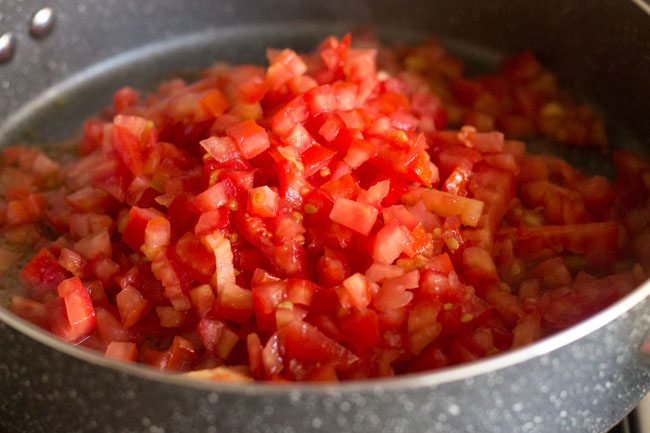 chopped tomatoes added to the pan. 