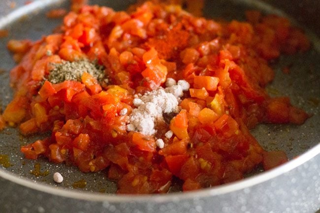 red chili powder, black pepper powder and rock salt added to the tomatoes. 