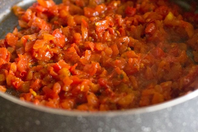 spices and salt mixed well with the tomatoes. 