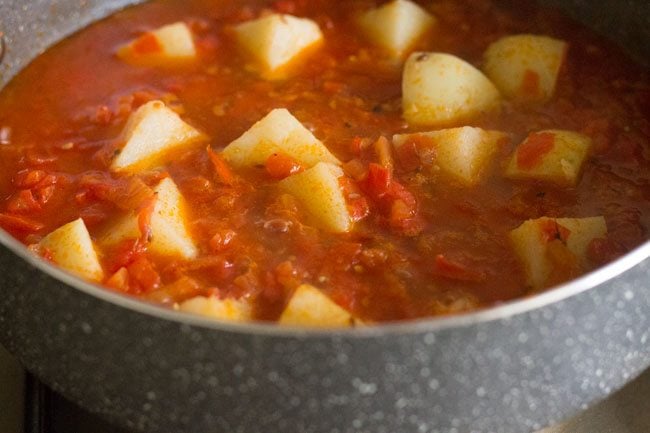 cooking aloo tamatar sabzi.