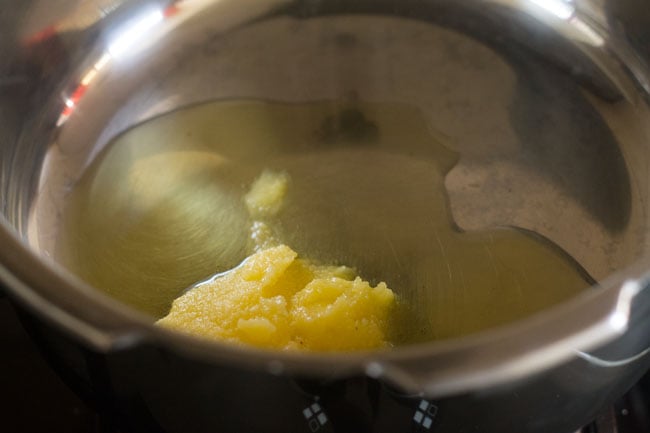 Put the ghee in the pressure cooker