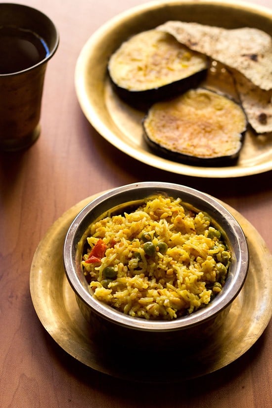 Bengali khichdi served with baingan bhaja and papad