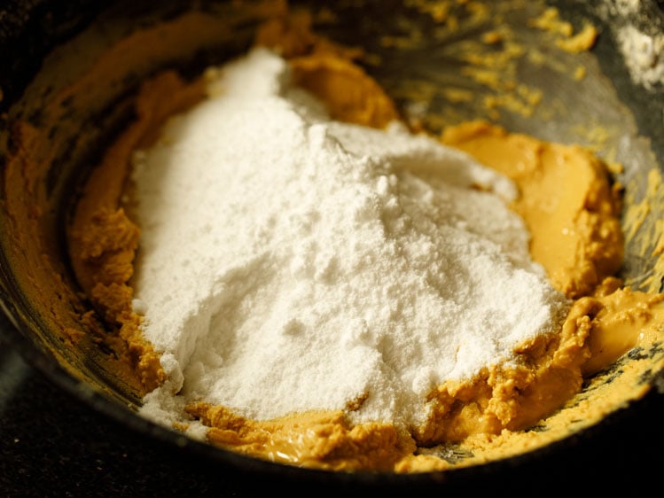 powdered sugar added to the roasted besan and ghee mixture