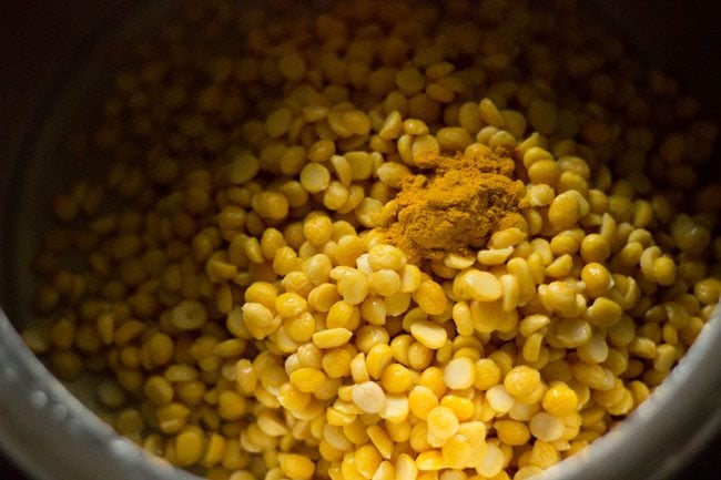 soaked chana dal in pressure cooker with ½ teaspoon turmeric powder