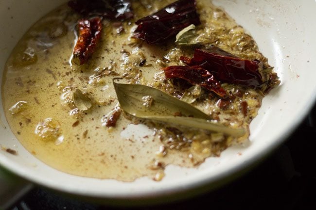 frying spices in ghee for tempering 