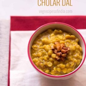 cholar dal in a bowl topped with fried coconut