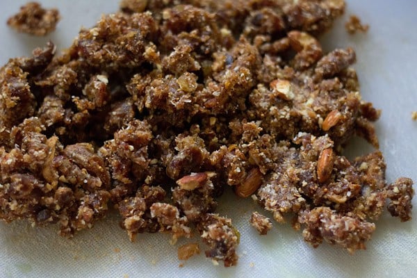 ground coarse mixture of the nuts and dry fruits on a white board