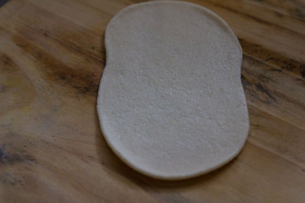 rolling bhatura dough