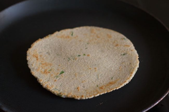 flip and cooking second side of kuttu ka paratha