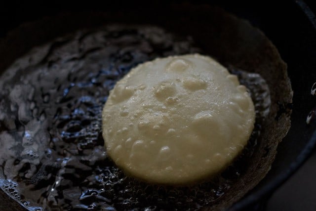 frying luchi in hot oil. 