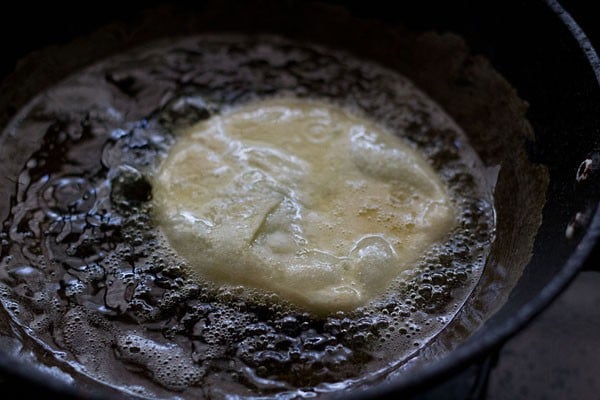 frying koraishutir kochuri in hot oil.