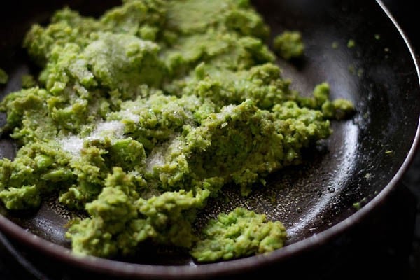 ground peas paste, suagr and salt added to the pan. 