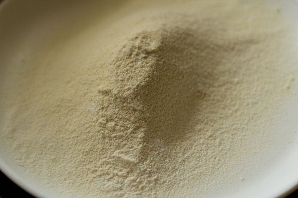 top shot of sifted dry ingredients on white plate.