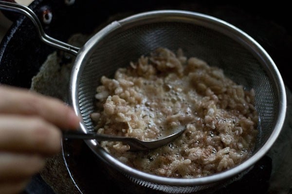 frying poha to make namkeen recipe