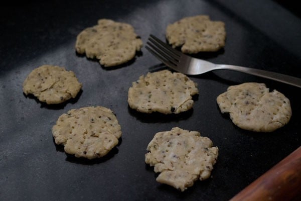 rolled mathri dough pricked with a fork