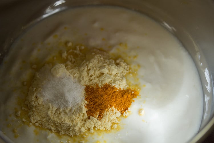 turmeric powder and salt added to the curd. 