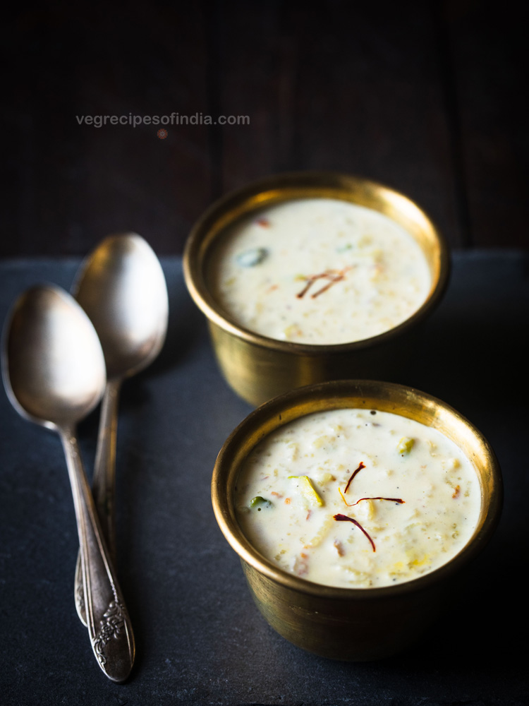 rice kheer served in individual bowls with 2 spoons kept on the left side and text layover. 