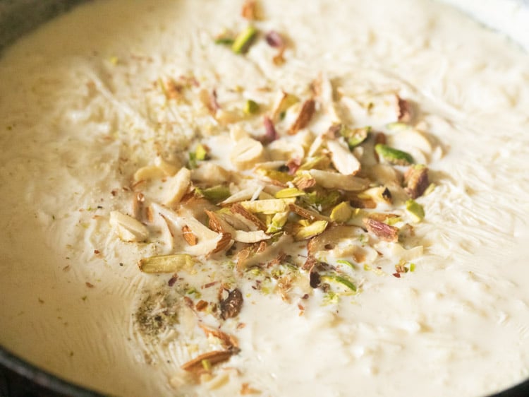 adding chopped dry fruits to kheer