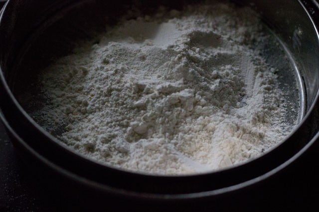 powdered sugar-cardamom mixture and nutmeg powder added to chana dal powder. 