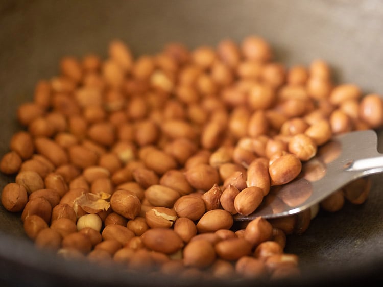 roasting peanuts in a frying pan for sabudana khichdi recipe. 