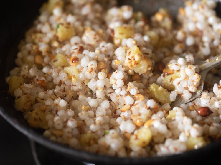 sabudana-peanut powder mixture mixed well with potatoes.