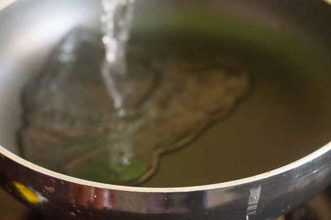 heating water in a pan for making sugar solution. 