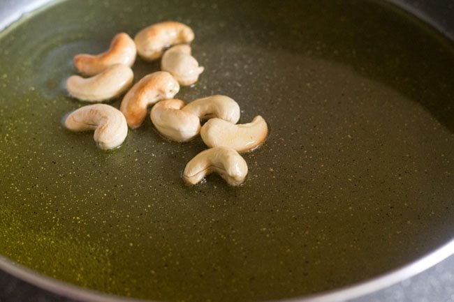 cashews fried till golden for atta halwa recipe. 