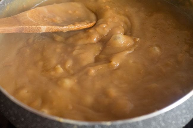 stirring wheat-sugar solution mixture so that lumps are not formed. 