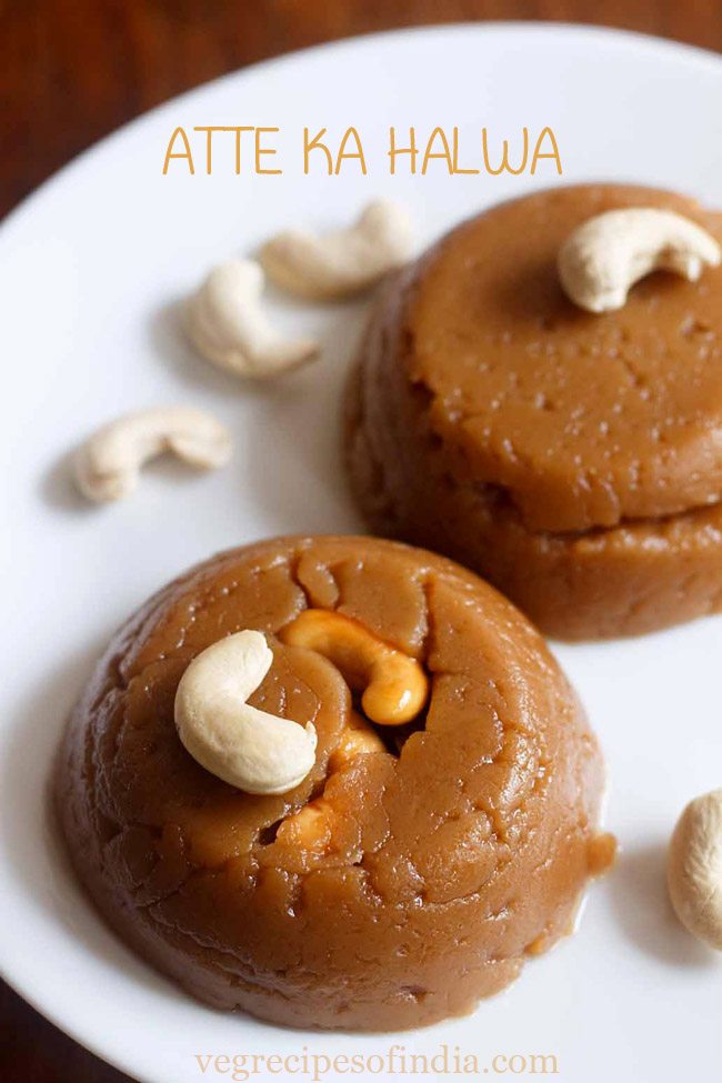 wheat halwa garnished with cashew and served on a white plate with text layover.