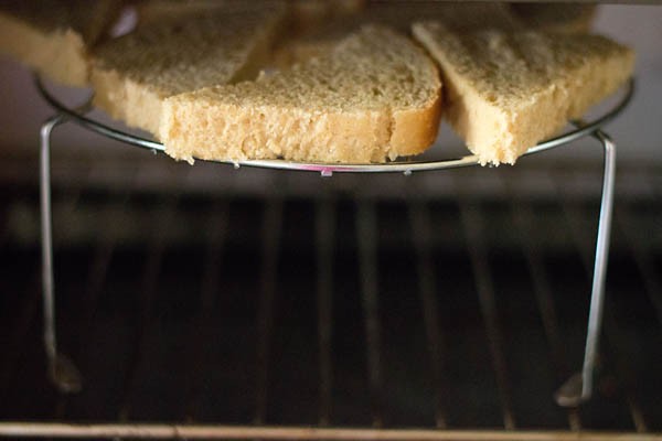 baking the toast in the oven.