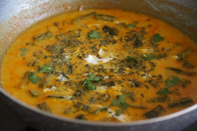 simmering the dahi bhindi gravy