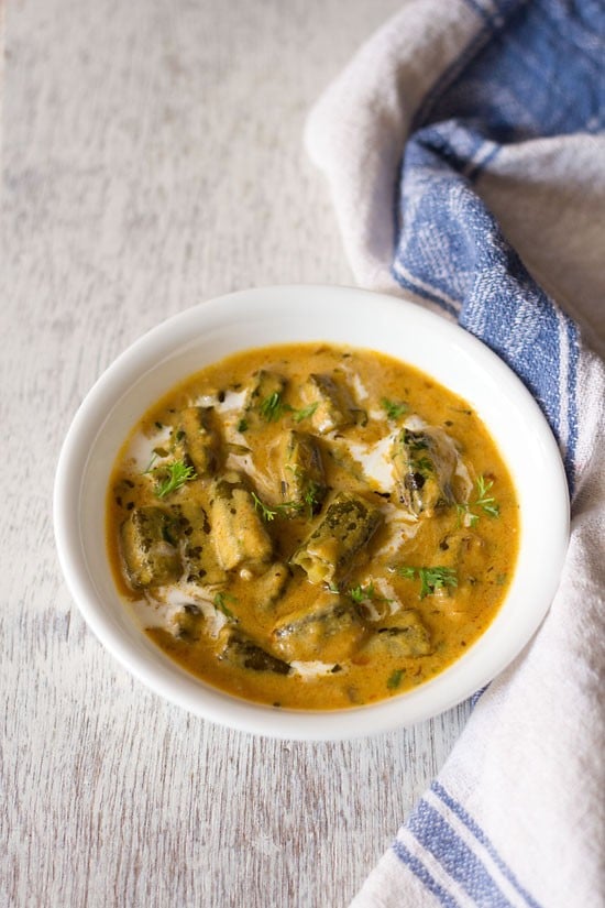 dahi bhindi served in a white bowl