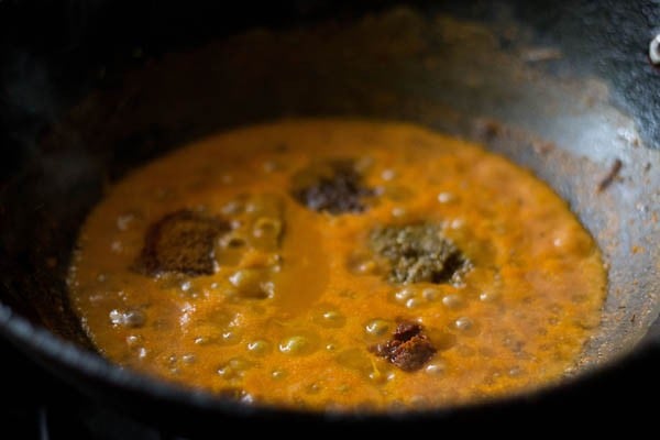 spice powders added to the pan. 