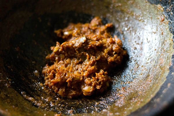 sautéing spiced onion masala till oil leaves the sides. 