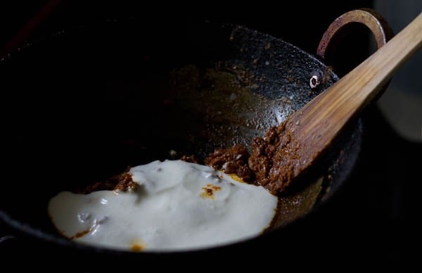 whisked full fat curd added to the masala. 