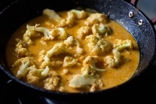 cooking gobi masala. 