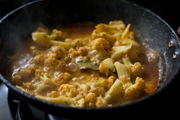 cooking gobi masala. 