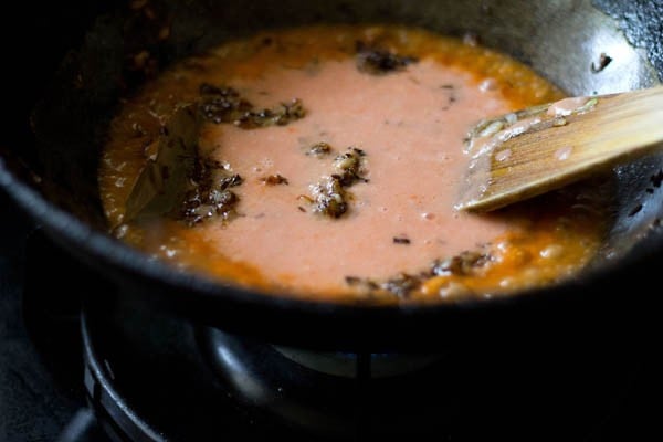 tomato-cashew paste added to the pan. 