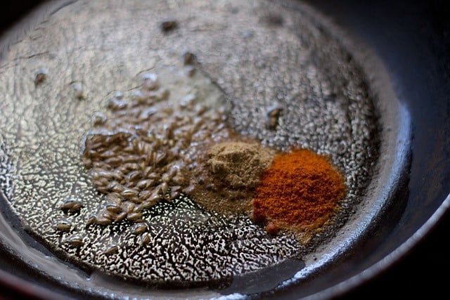 frying spices in a small frying pan