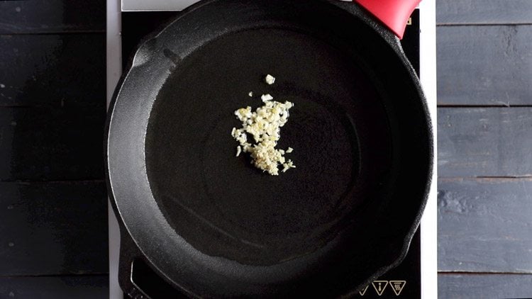 finely chopped garlic and ginger in hot oil in a cast iron pan