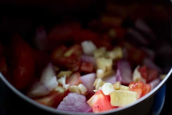 onions, tomato, ginger and garlic chopped in the base of a spice grinder