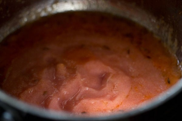 tomato onion paste added to cumin oil