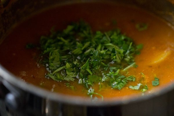 coriander being added for aloo matar recipe