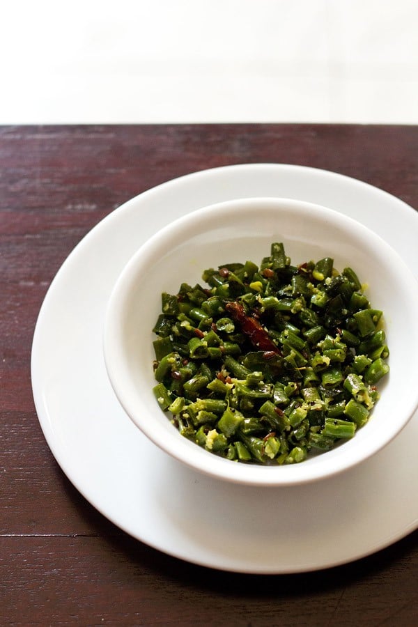 beans poriyal served in a white bowl