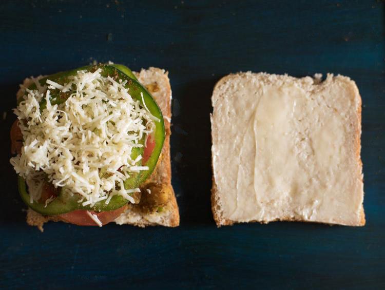 grated cheese added on vegetables for making chana sandwich.